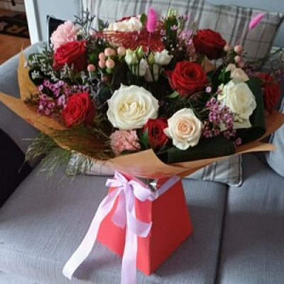 For ever yours - Mixed valentines red and cream roses with seasonal fillers and foliage.