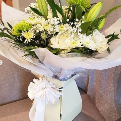 Magical White - Classic blooms in wintery whites and creams, with lush green foliage.