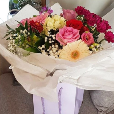 Pretty Pink Bouquet - The flowers used can vary due to seasonal availability but normally include Roses, gerberas and lisianthus in pretty shades of pinks.