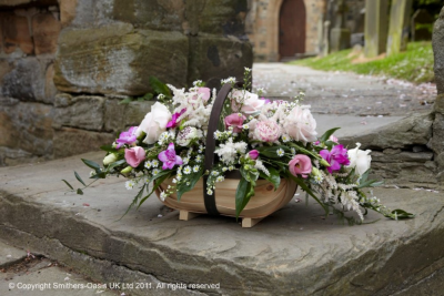 PINK BASKET - A selection of pink and white flowers with foliage presented in a contemporary basket.