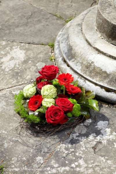 RED AND GREEN BASKET - A modern basket including red roses.